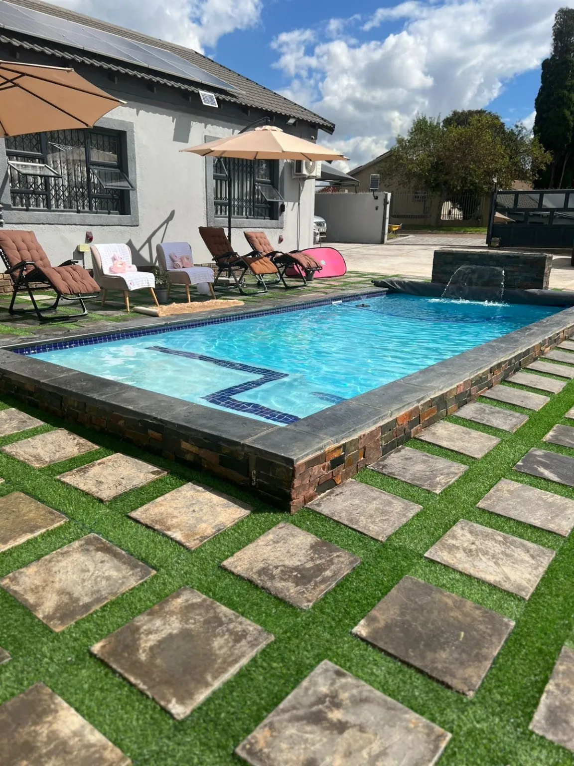 Luxury pool with spa and water feature